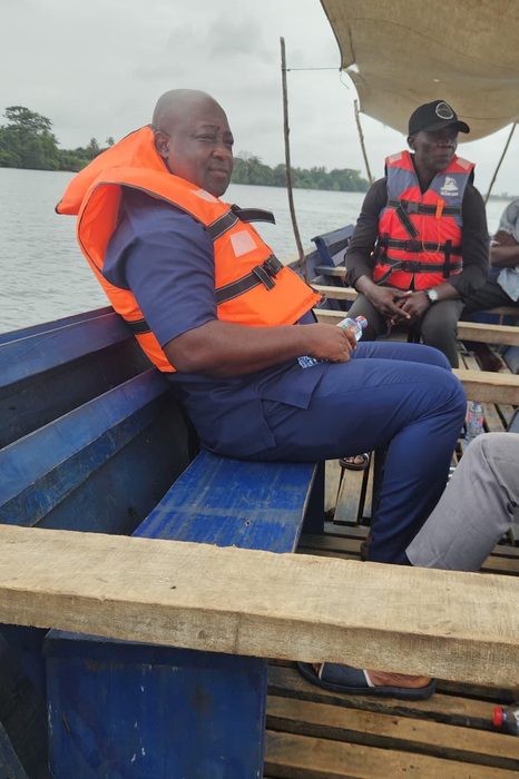 Frank Quarshie Djagbletey in a life jacket on a boat on the Volta
